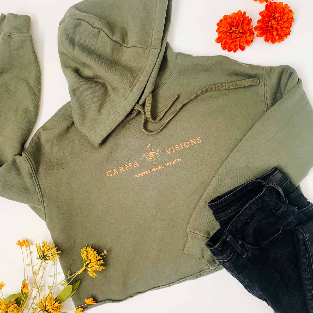 Carma Visions crop hoodie in military green, styled flat lay
